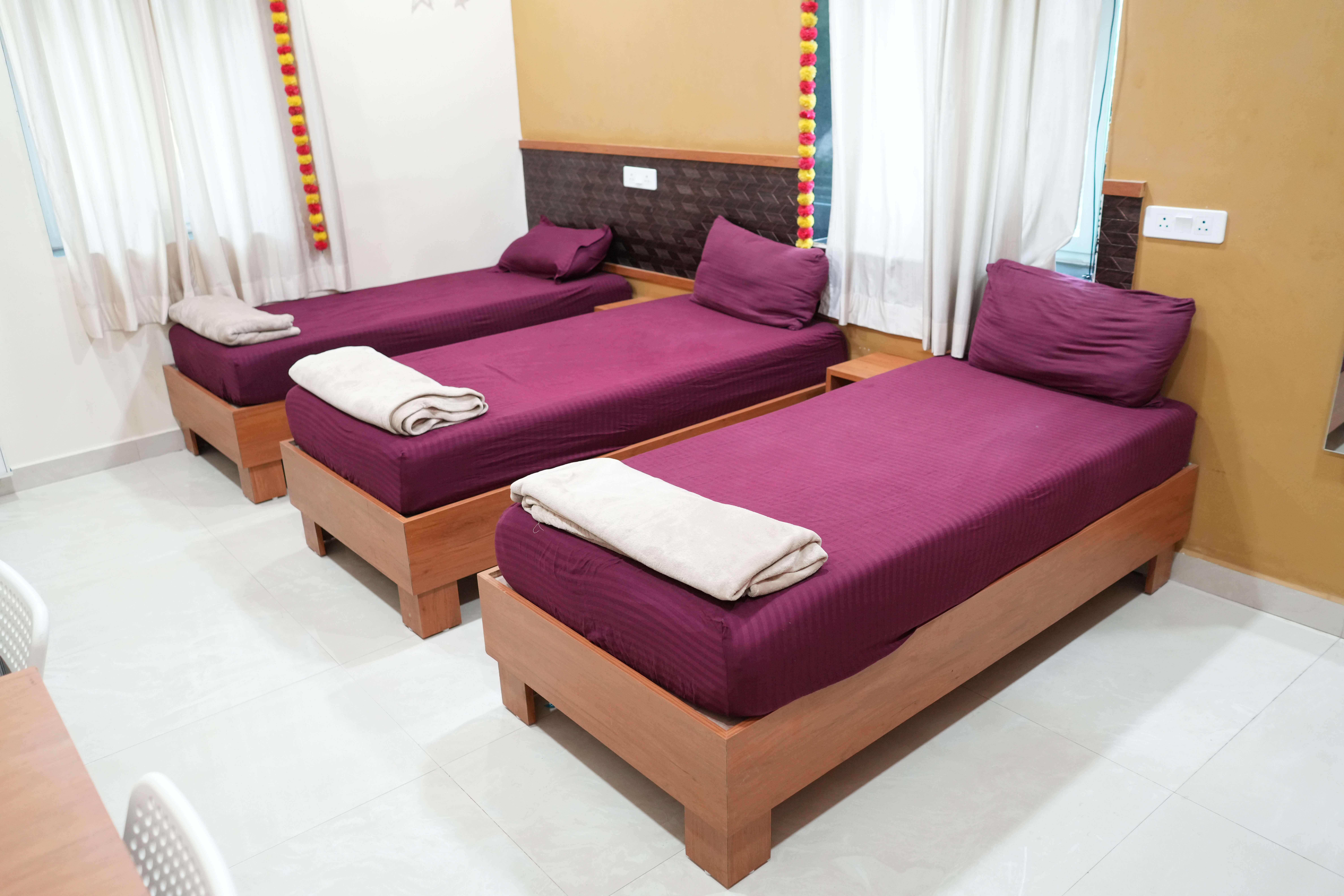 Triple sharing three-occupant co-living room